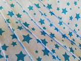 Pale blue fabric bunting with bright turquoise stars
