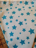 Pale blue fabric bunting with bright turquoise stars