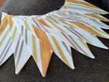 Stripy fabric bunting, mustard, yellow and shades of brown.