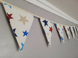 Colourful bunting with stars on cream cotton