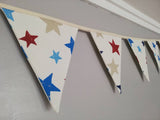 Colourful bunting with stars on cream cotton