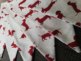 Sausage dog bunting ! Dark red dogs in a variety of poses on a natural background fabric. #sausagedoggifts #sausagedog