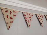 Sausage dog bunting ! Dark red dogs in a variety of poses on a natural background fabric. #sausagedoggifts #sausagedog