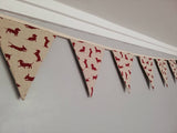 Sausage dog bunting ! Dark red dogs in a variety of poses on a natural background fabric. #sausagedoggifts #sausagedog