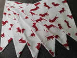 Sausage dog bunting ! Dark red dogs in a variety of poses on a natural background fabric. #sausagedoggifts #sausagedog