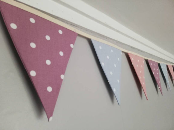 Pink, blue and purple dotty fabric bunting.