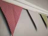Spotty bunting, dusky pink, sage green and dove grey.