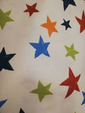 Colourful bunting with stars on cream cotton