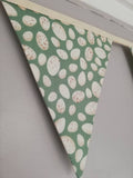 Green fabric bunting with lovely egg design. 10 flags, approx 2.5 metres
