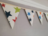 Colourful bunting with stars on cream cotton
