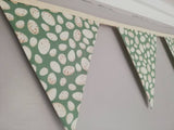 Green fabric bunting with lovely egg design. 10 flags, approx 2.5 metres