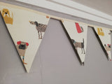 Stylistic dogs Fabric Bunting, on a cream background. 10 flags, approx 2.5 metres