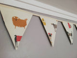 Stylistic dogs Fabric Bunting, on a cream background. 10 flags, approx 2.5 metres