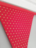 Gold star fabric bunting on red background, approx 2.5 metres