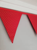 Gold star fabric bunting on red background, approx 2.5 metres